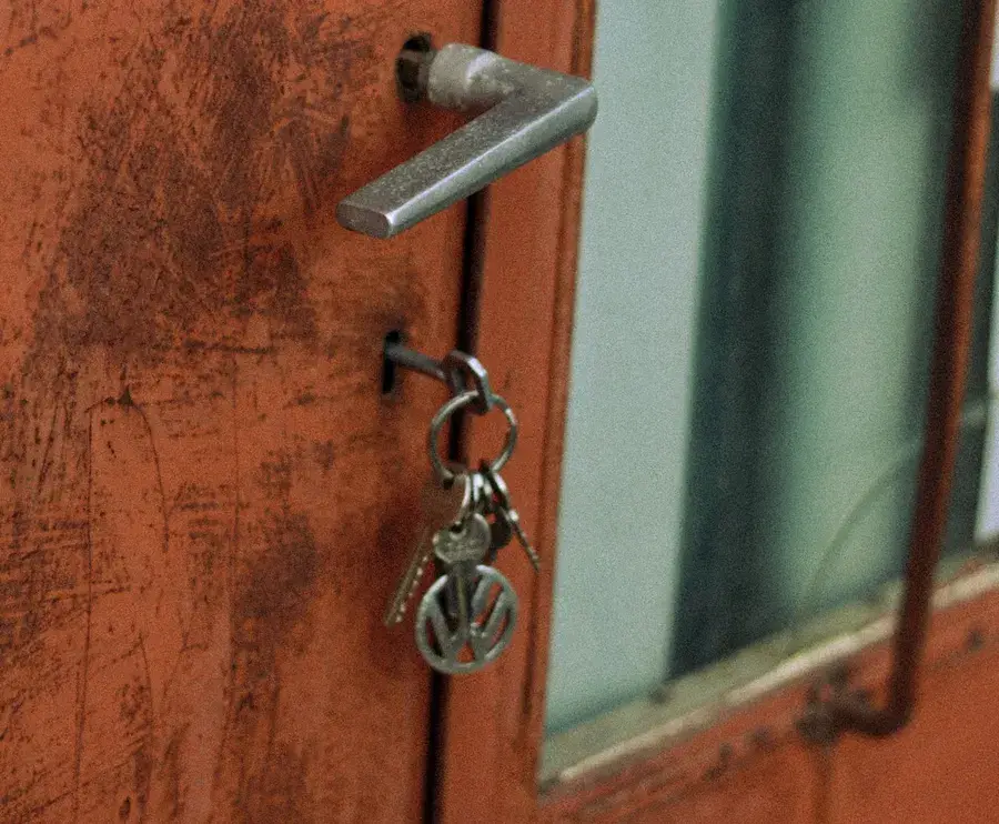Keys hanging from the lock of an old door – why keys snap and when broken key removal Farnborough is needed, Locksmith Farnborough