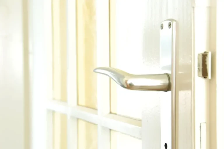 Lock repair or replacement in Farnborough – white door with a lever handle and locking plate, Locksmith Farnborough guide to which your door needs