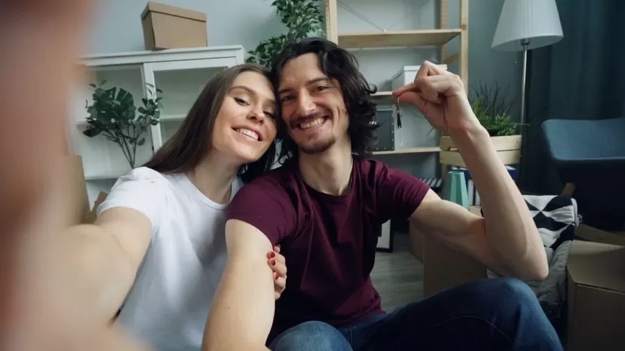 Couple holding up keys in their new home – residential locksmith Farnborough help for homeowners from Locksmith Farnborough