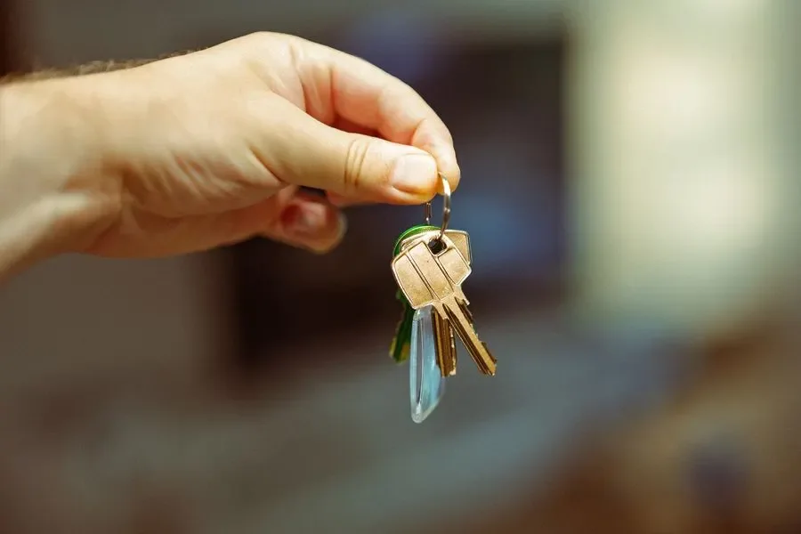 Hand holding a set of house keys – residential locksmith Farnborough help for landlords and letting agents from Locksmith Farnborough